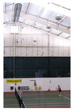 Women Playing In The Tennis Court
